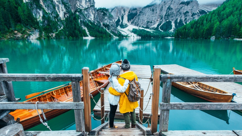 Mountain stories. Happy couple on a wanderlust vacation.