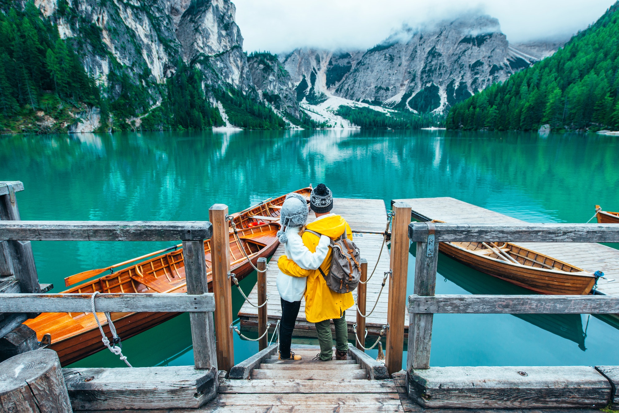 Mountain stories. Happy couple on a wanderlust vacation.